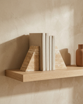 Geometric Travertine Stone Bookends styled in a modern home interior